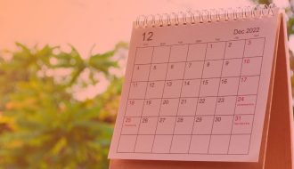 a calendar month with trees in the background