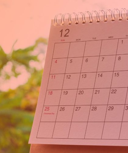 a calendar month with trees in the background