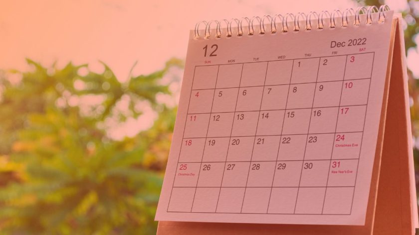 a calendar month with trees in the background