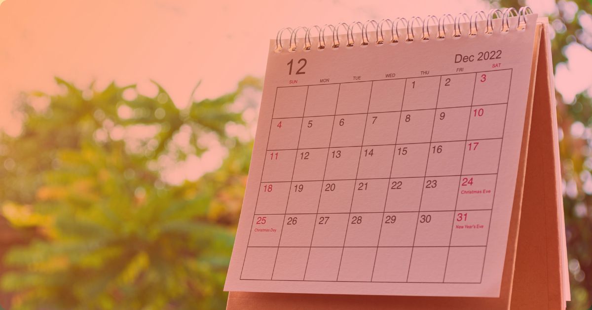 a calendar month with trees in the background