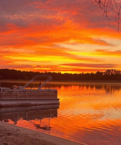 looking out on the lake with the sunrise lighting the sky