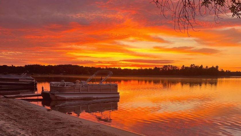 looking out on the lake with the sunrise lighting the sky