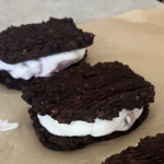 Two Homemade Ice Cream Sandwiches on Parchment Paper