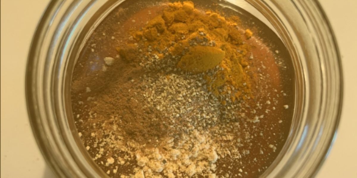 close up of honey and unmixed spices