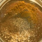 close up of honey and unmixed spices