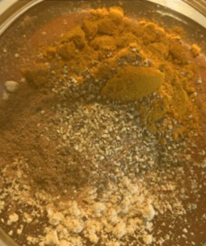 close up of honey and unmixed spices