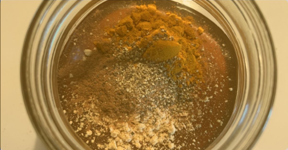 close up of honey and unmixed spices