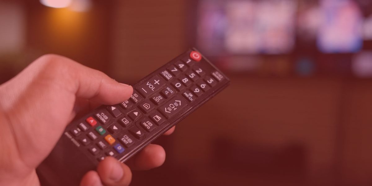 a person holding a remote control