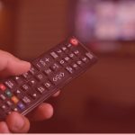 a person holding a remote control