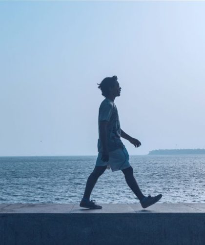 a person walking by the water