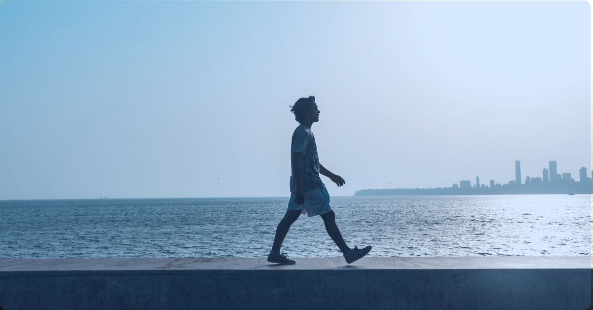 a person walking by the water
