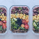nicely organized meal prep containers full of colorful nutrients