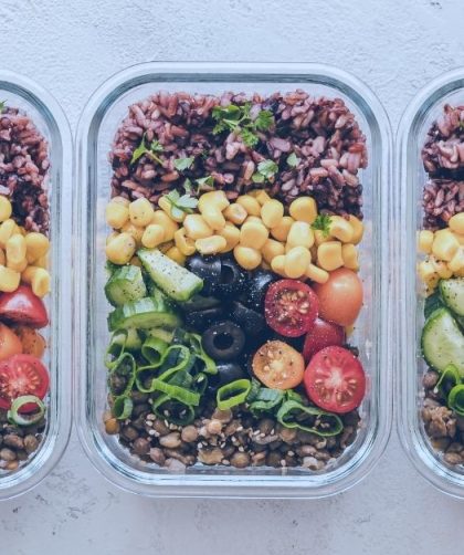 nicely organized meal prep containers full of colorful nutrients