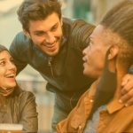 a guy greeting a group of friends