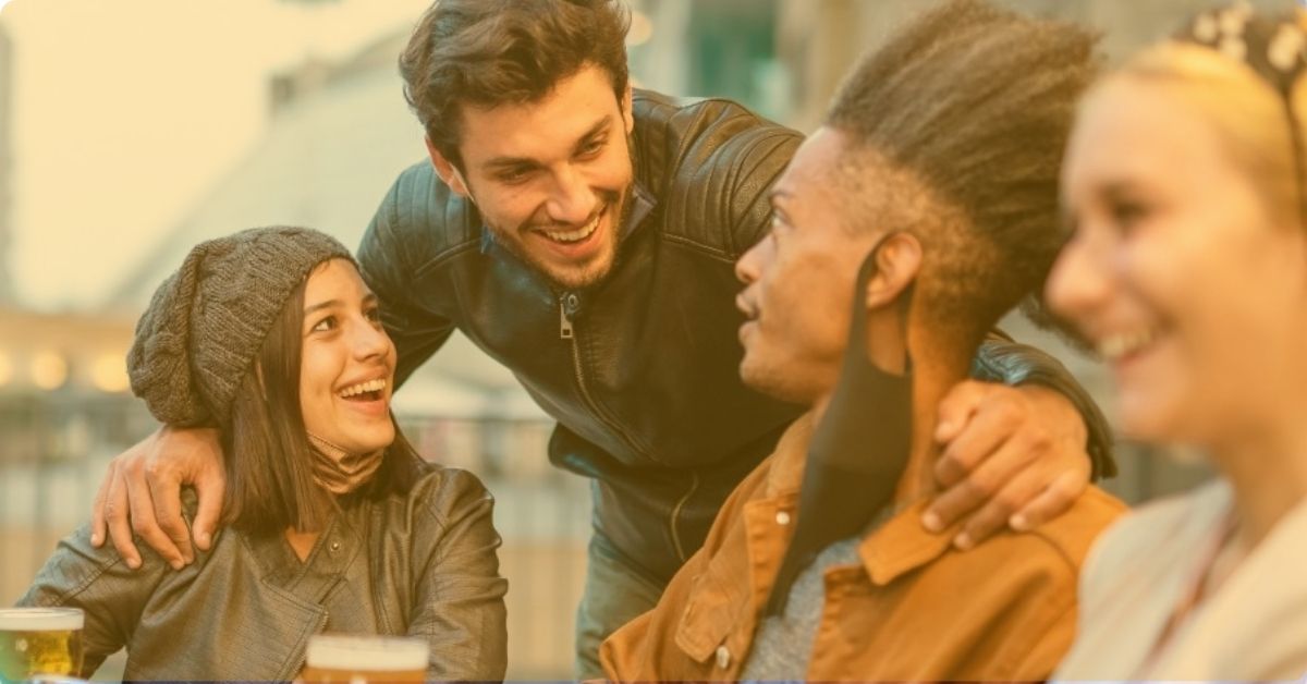 a guy greeting a group of friends